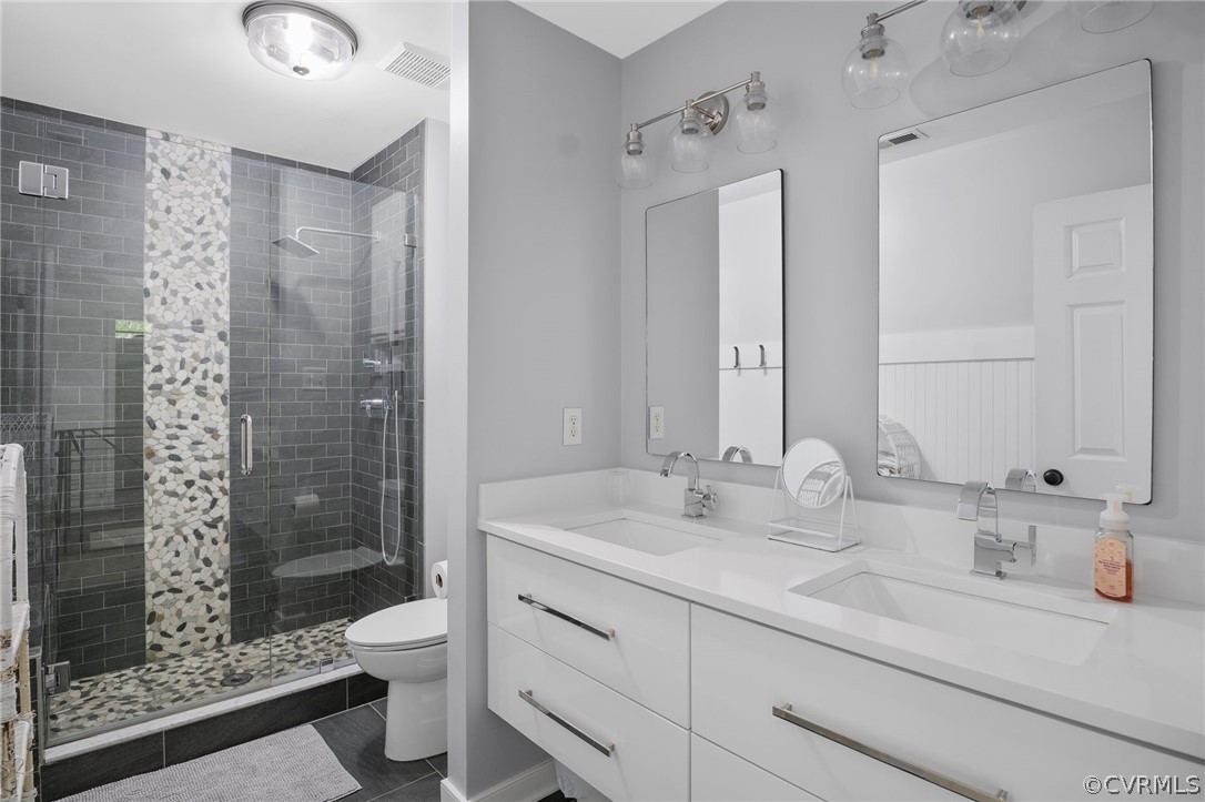 14012 Lenox Forest Court Midlothian, VA 23113 - Photo 33 of 49 a bathroom with a double vanity sink toilet and shower