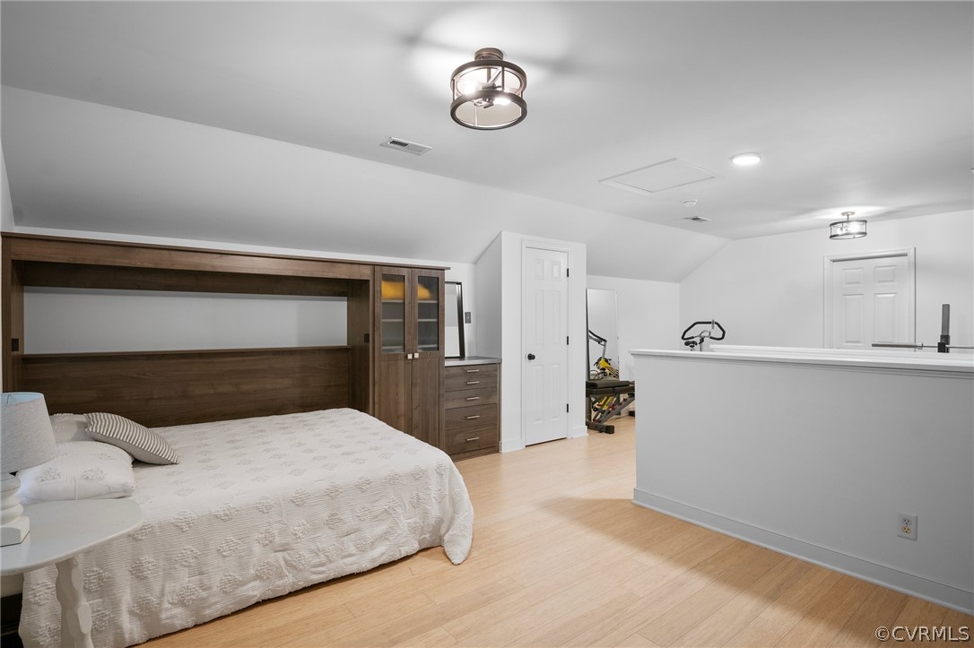 14012 Lenox Forest Court Midlothian, VA 23113 - Photo 42 of 49 a bedroom with a large bed and a chandelier