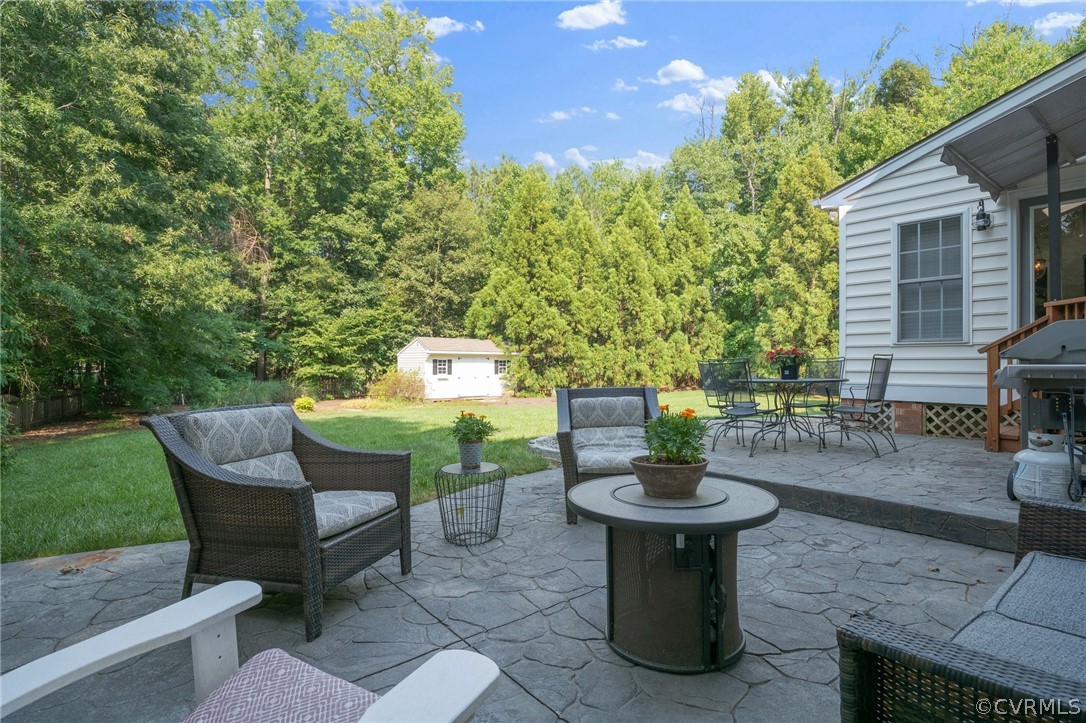 14012 Lenox Forest Court Midlothian, VA 23113 - Photo 46 of 49 a view of a chairs and table in the back yard of the house