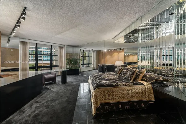 a view of a room with lots of shower and chandelier fan