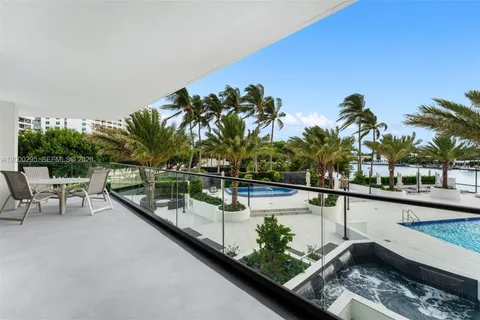 a view of swimming pool with outdoor seating and plants