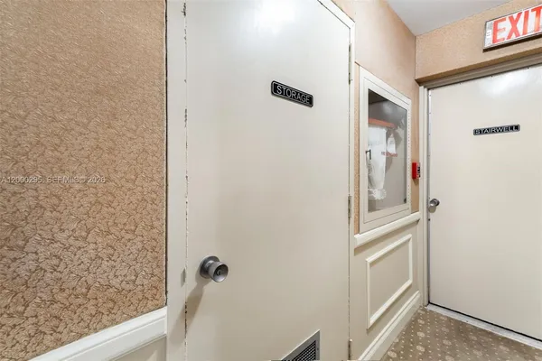 a view of swimming pool with a table and chairs
