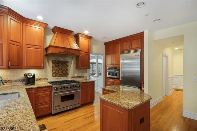 a view of a workspace with furniture and wooden floor