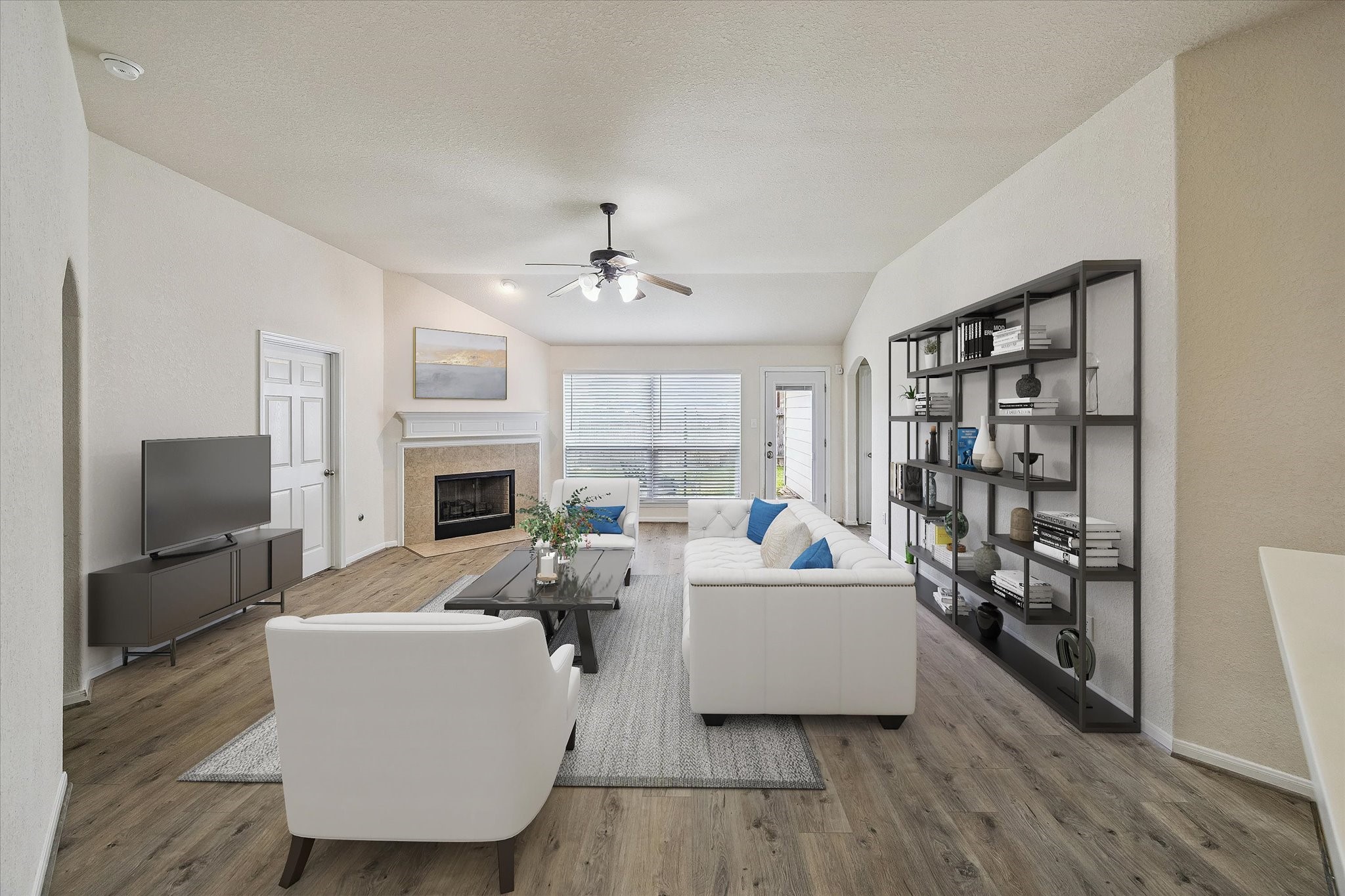 19403 Valiant Woods Drive Spring, TX 77379 - Photo 21 of 42 a living room with furniture and a fireplace