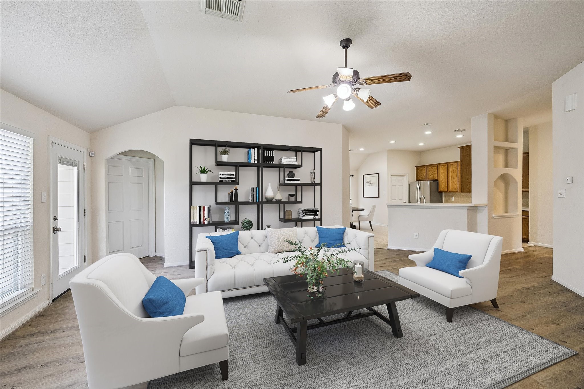 19403 Valiant Woods Drive Spring, TX 77379 - Photo 22 of 42 a living room with furniture or couch and a bookshelf