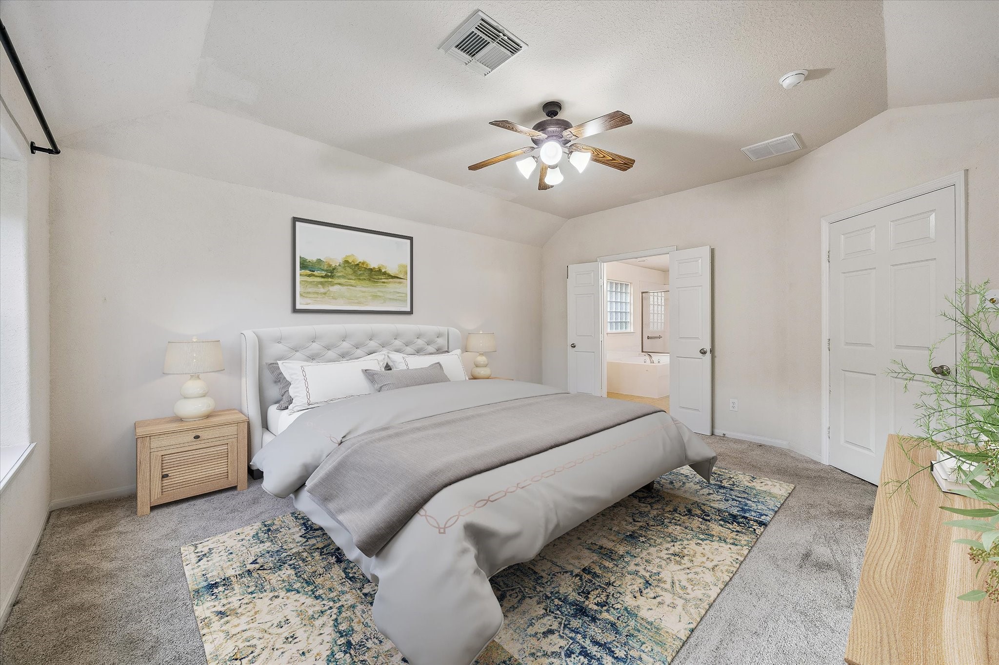 19403 Valiant Woods Drive Spring, TX 77379 - Photo 27 of 42 a spacious bedroom with a bed and a chandelier