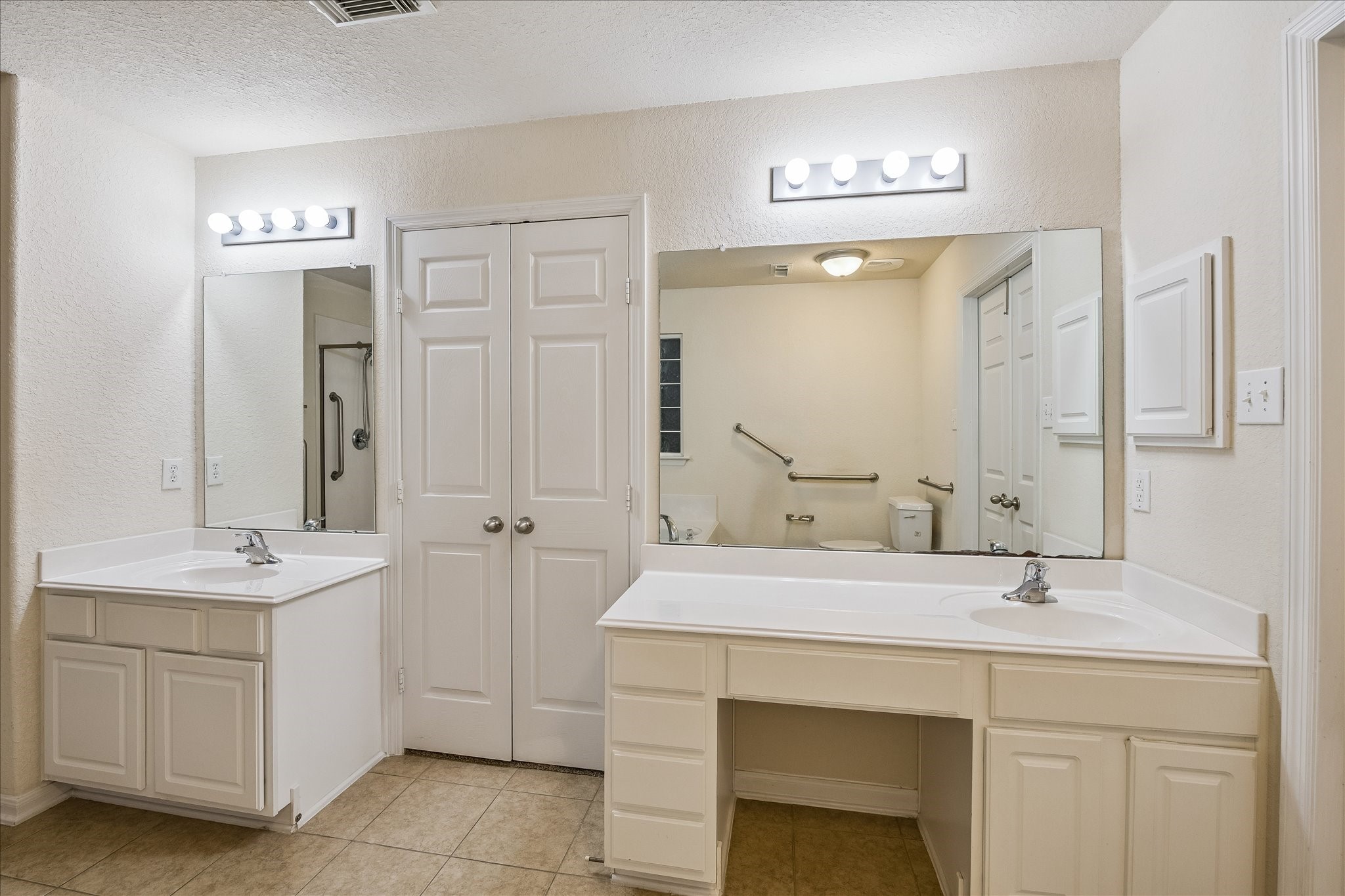 19403 Valiant Woods Drive Spring, TX 77379 - Photo 31 of 42 a bathroom with a sink double vanity and a mirror