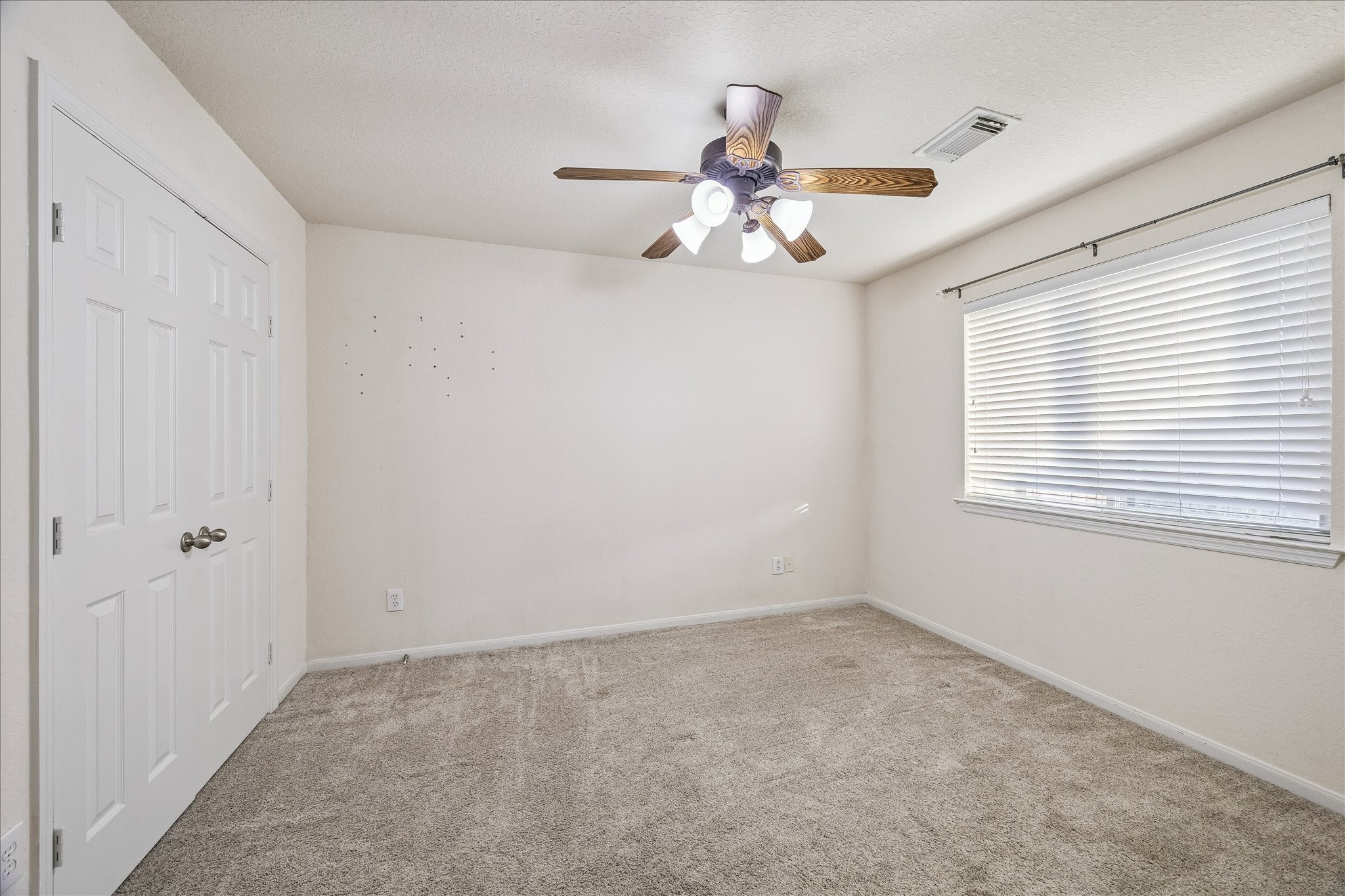 19403 Valiant Woods Drive Spring, TX 77379 - Photo 34 of 42 a view of an empty room with a window