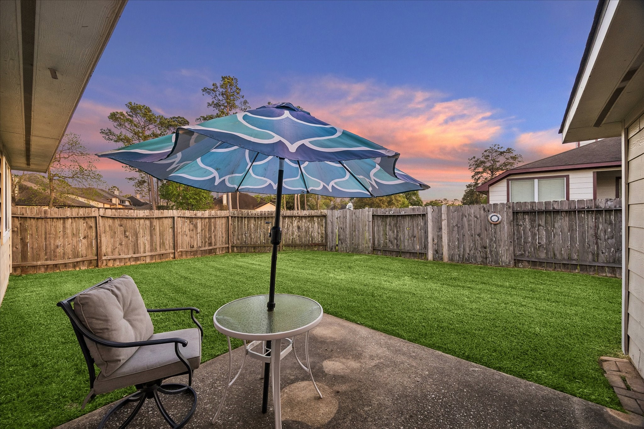 19403 Valiant Woods Drive Spring, TX 77379 - Photo 39 of 42 a view of a chair and table with umbrella in the garden