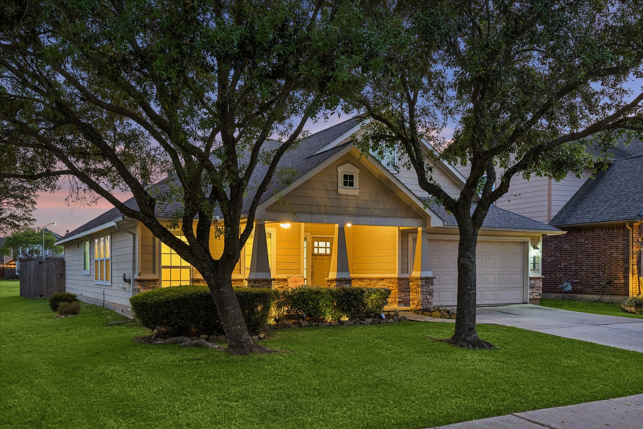 19403 Valiant Woods Drive Spring, TX 77379 - Photo 42 of 42 a front view of a house with a garden and tree