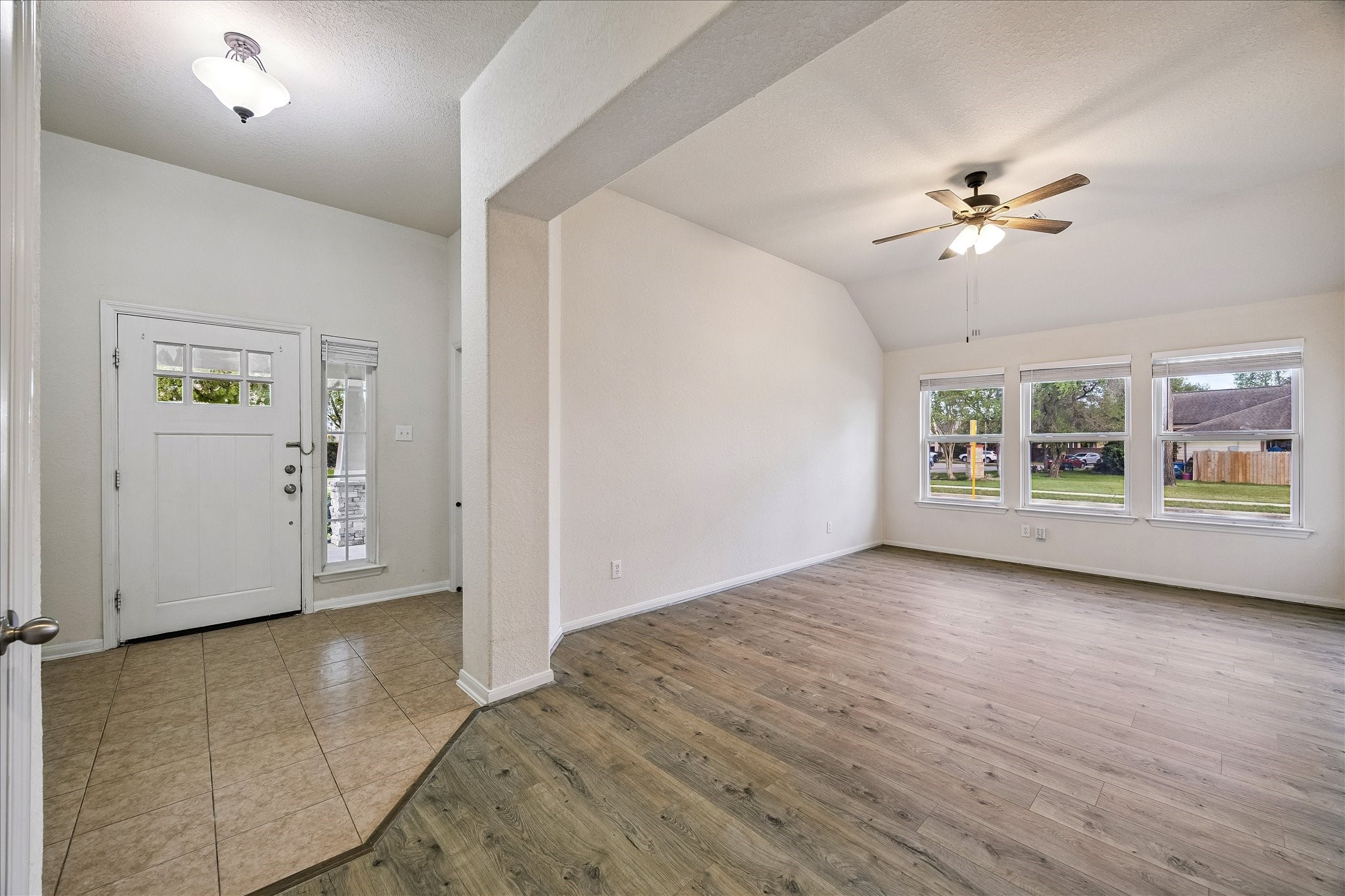 19403 Valiant Woods Drive Spring, TX 77379 - Photo 6 of 42 wooden floor in an empty room with a window