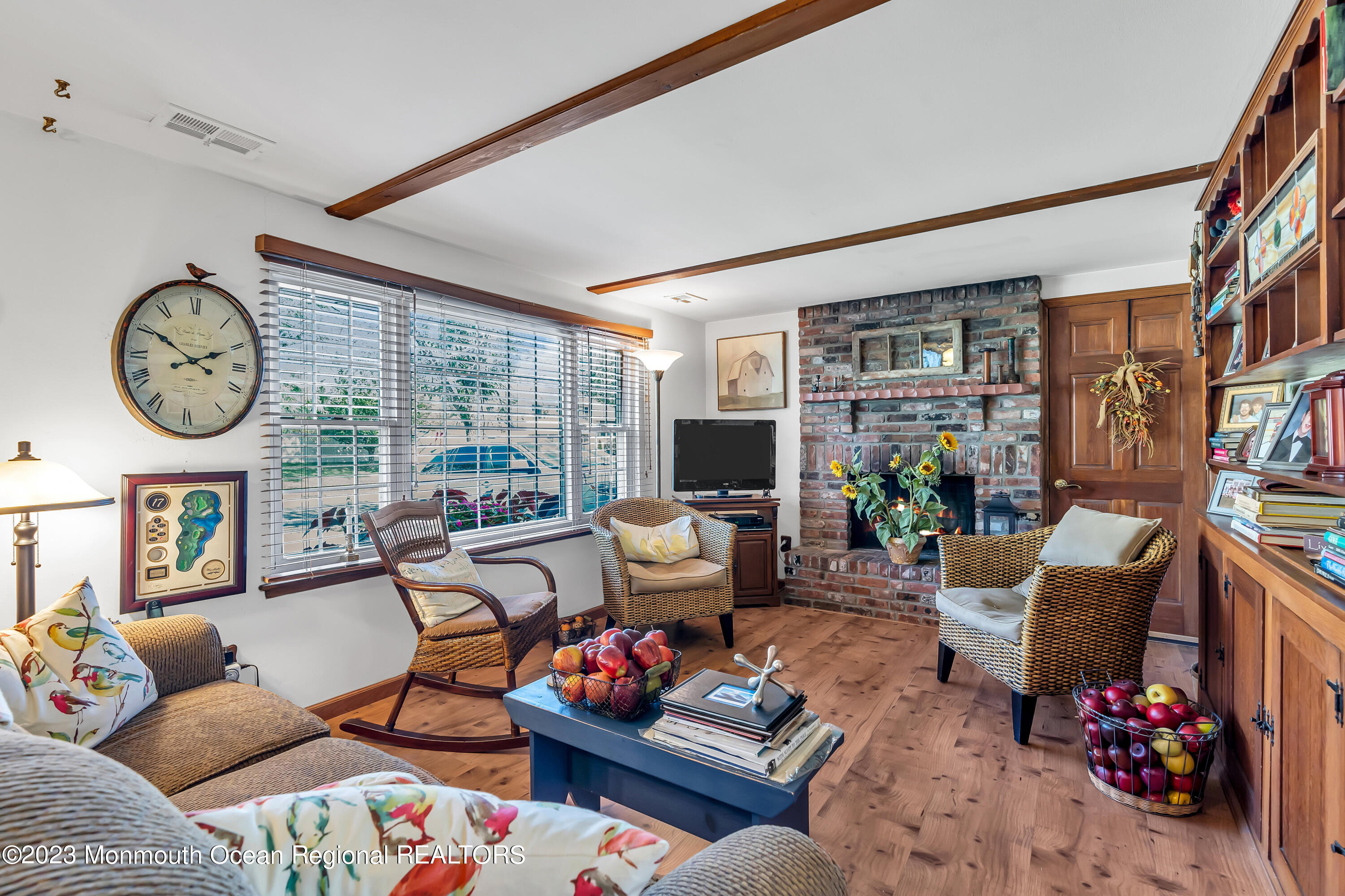 41 Citadel Drive Jackson, NJ 08527 - Photo 11 of 46 a living room with furniture a bookshelf and a large window