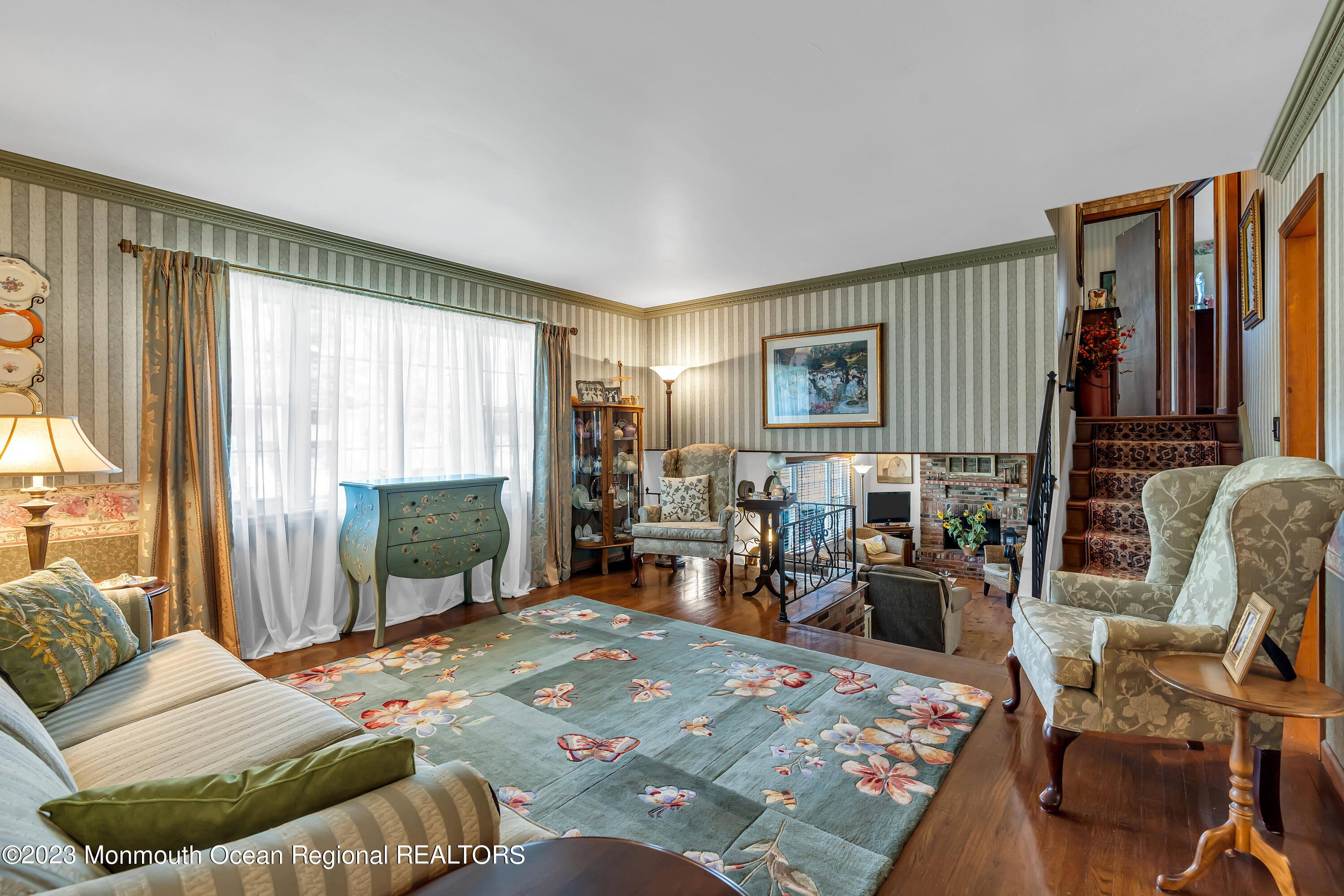 41 Citadel Drive Jackson, NJ 08527 - Photo 26 of 46 a bedroom with a bed a table chair and a flat tv screen next to a window