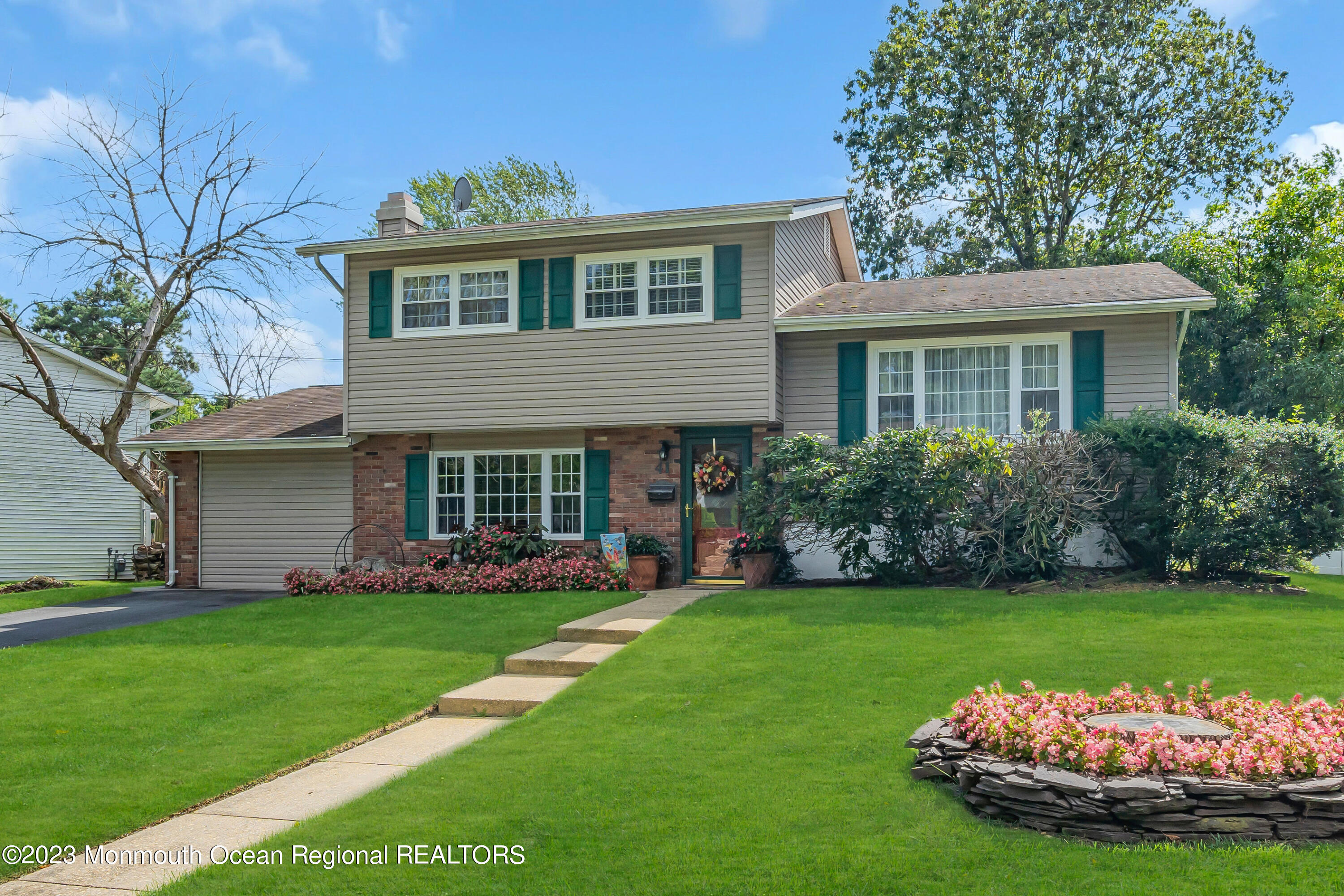 41 Citadel Drive Jackson, NJ 08527 - Photo 3 of 46 a front view of a house with a yard and garage