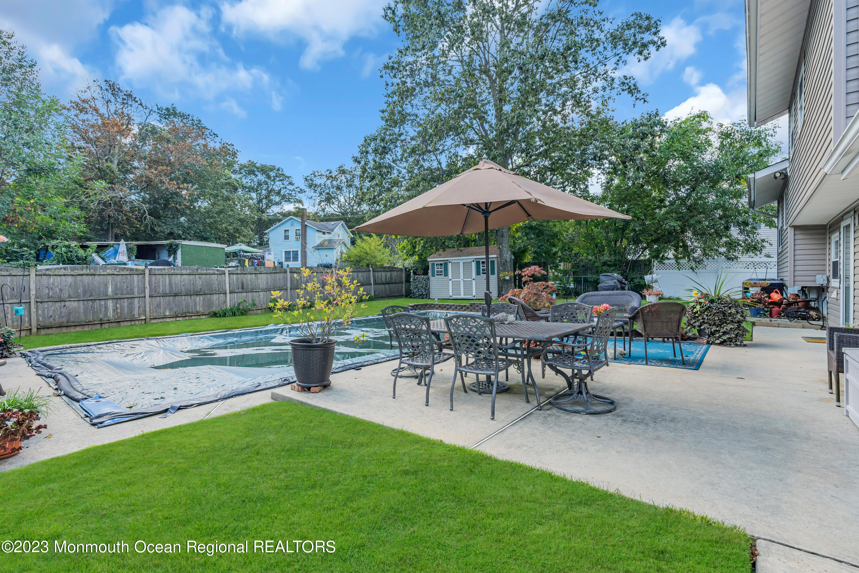 41 Citadel Drive Jackson, NJ 08527 - Photo 38 of 46 a view of a backyard with sitting area and furniture