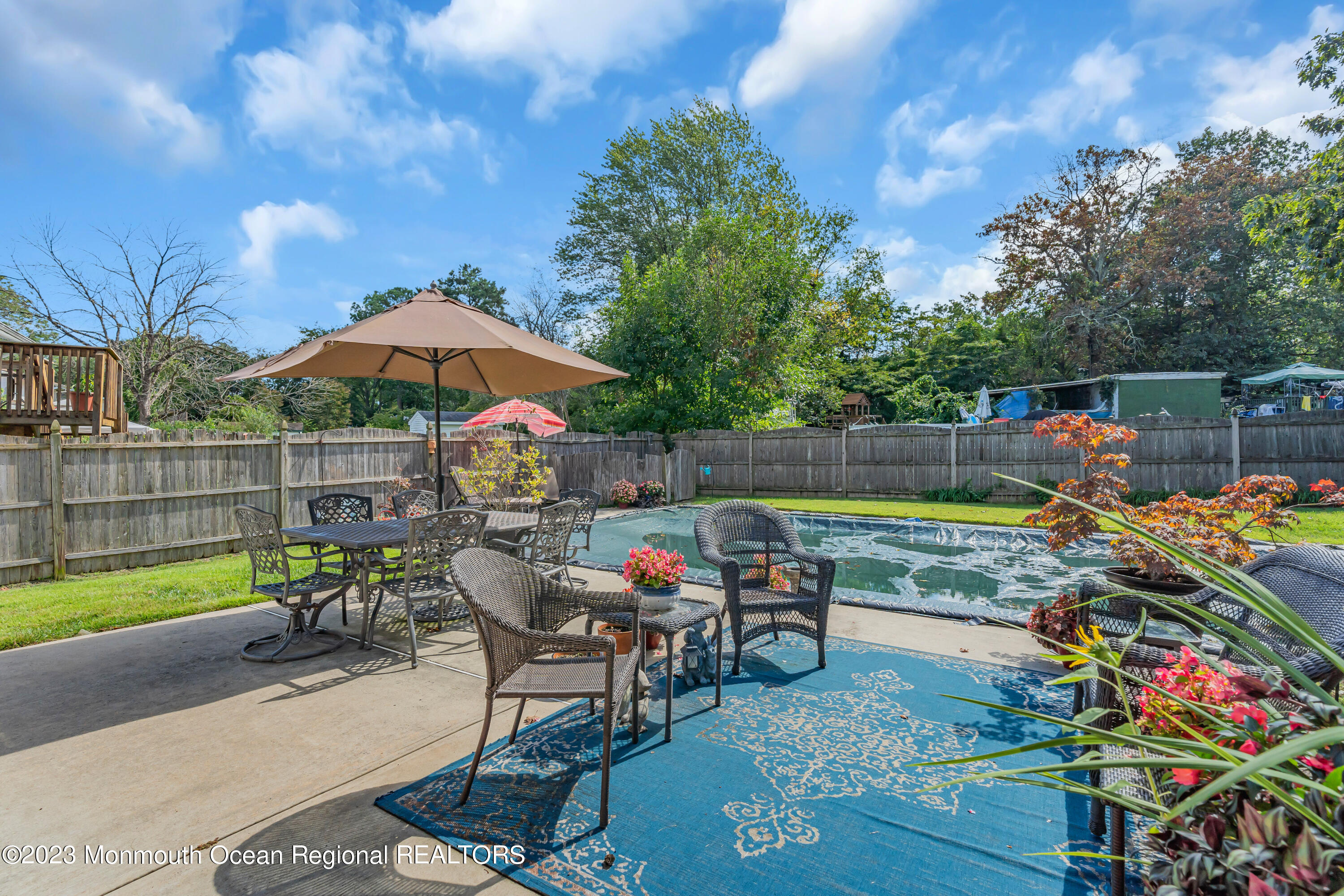 41 Citadel Drive Jackson, NJ 08527 - Photo 42 of 46 a view of a chairs and table in the back yard of the house
