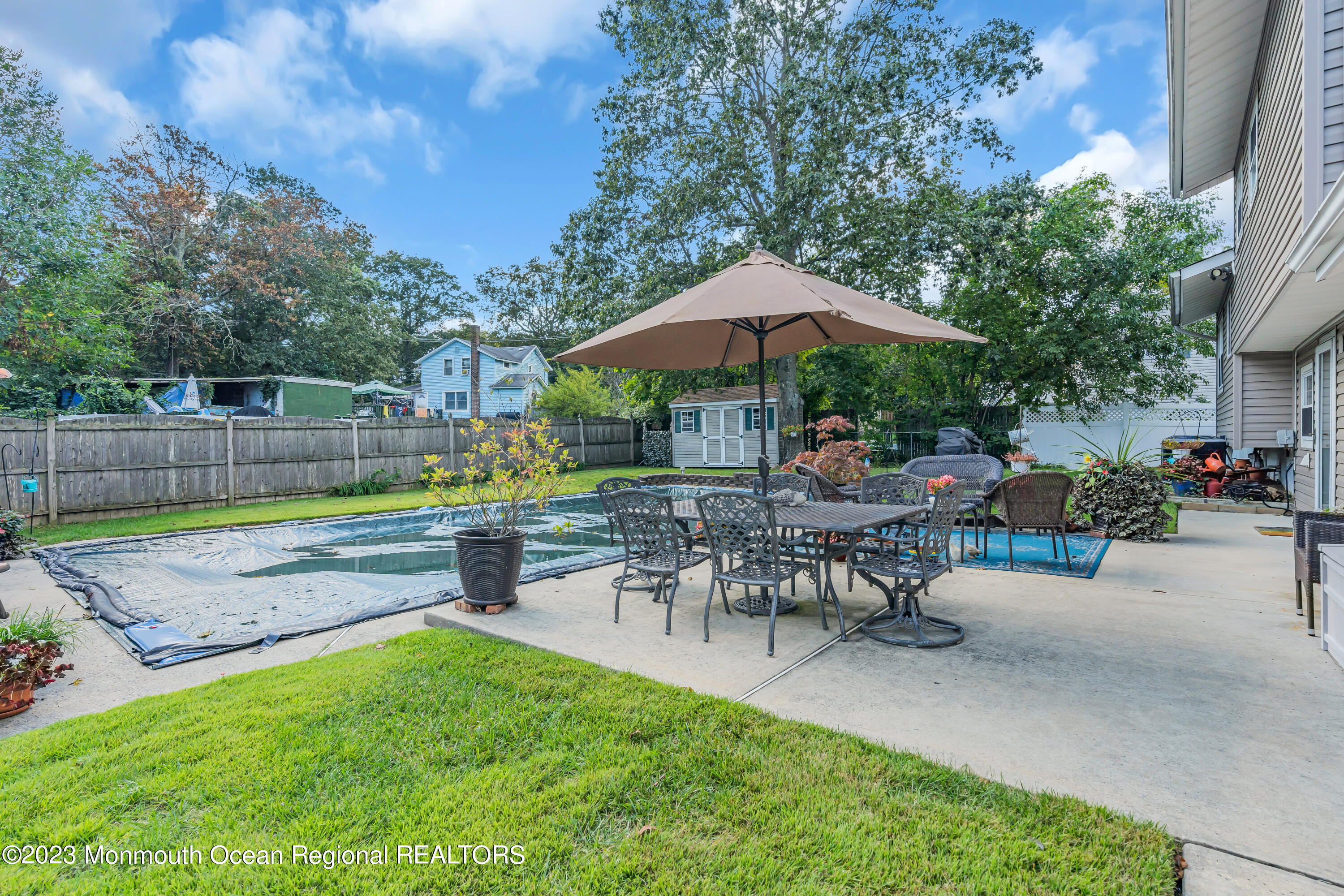41 Citadel Drive Jackson, NJ 08527 - Photo 44 of 46 a view of a backyard with sitting area and furniture