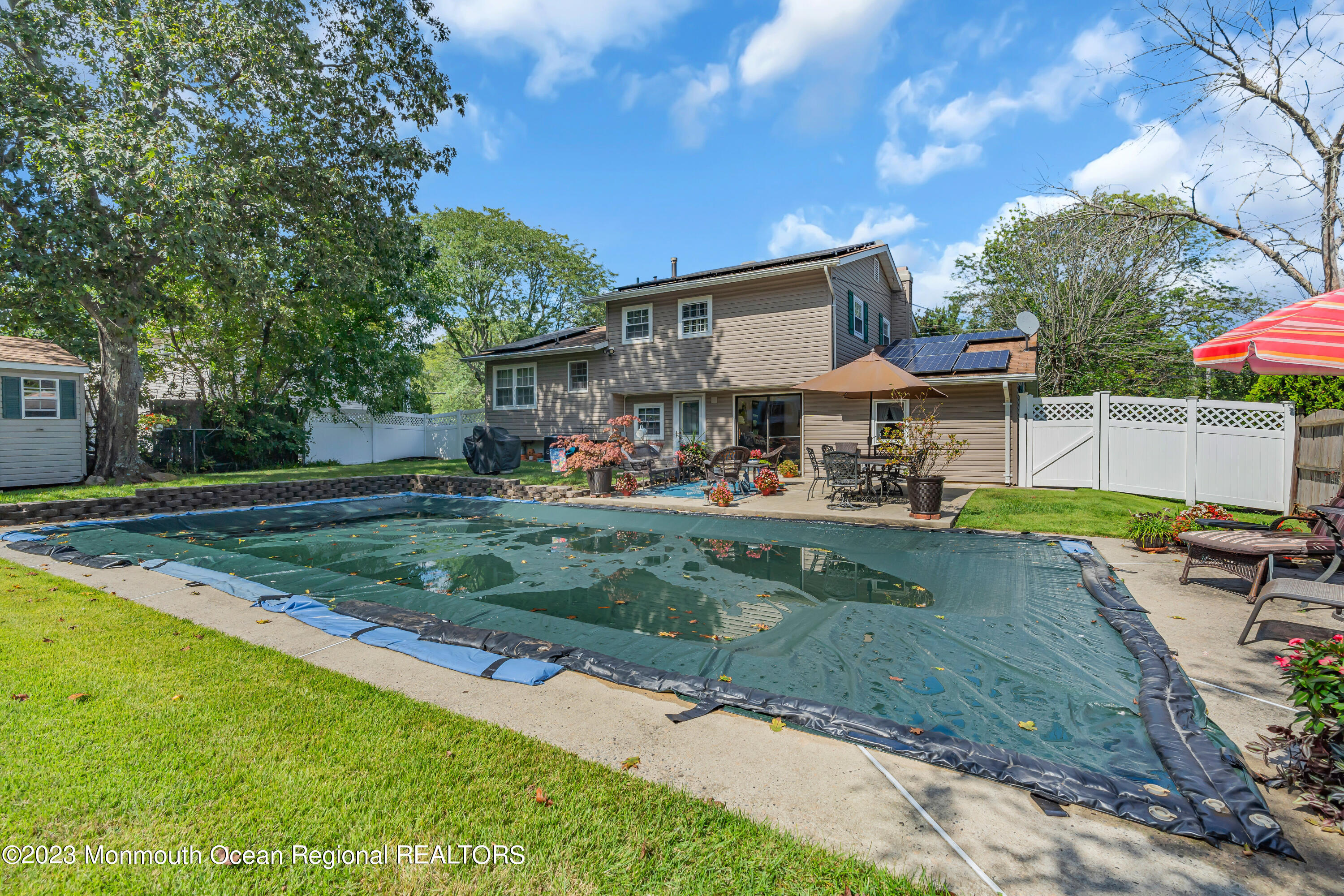 41 Citadel Drive Jackson, NJ 08527 - Photo 45 of 46 a view of a yard with plants and large trees