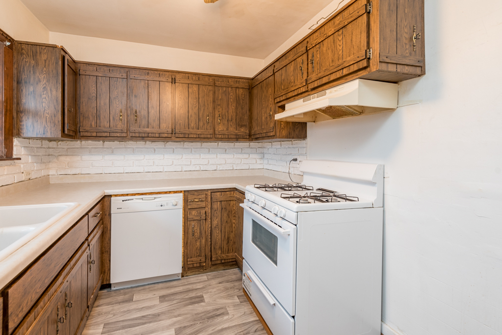 604 North Oplaine Road Waukegan, IL 60085 - Photo 12 of 31 a kitchen with a sink cabinets and stainless steel appliances