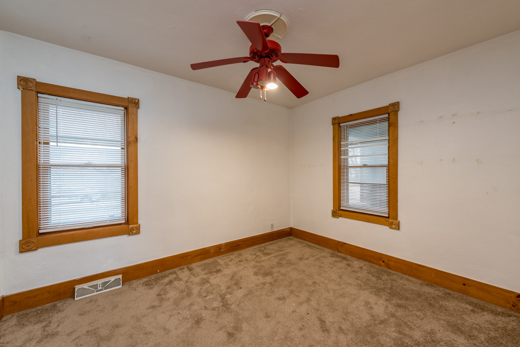 604 North Oplaine Road Waukegan, IL 60085 - Photo 19 of 31 a view of empty room with ceiling fan and window
