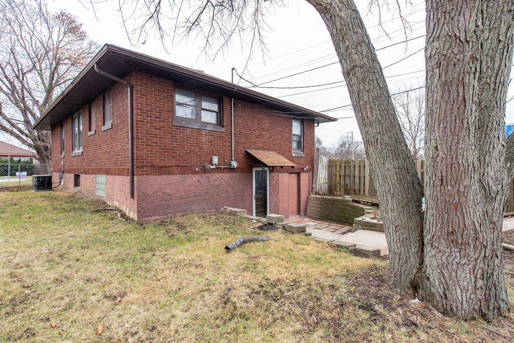 604 North Oplaine Road Waukegan, IL 60085 - Photo 28 of 31 a view of a house with a yard