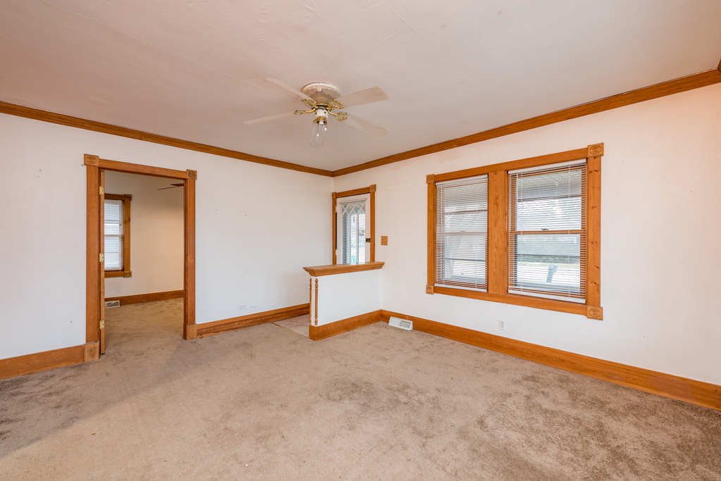 604 North Oplaine Road Waukegan, IL 60085 - Photo 3 of 31 a view of an empty room with a window