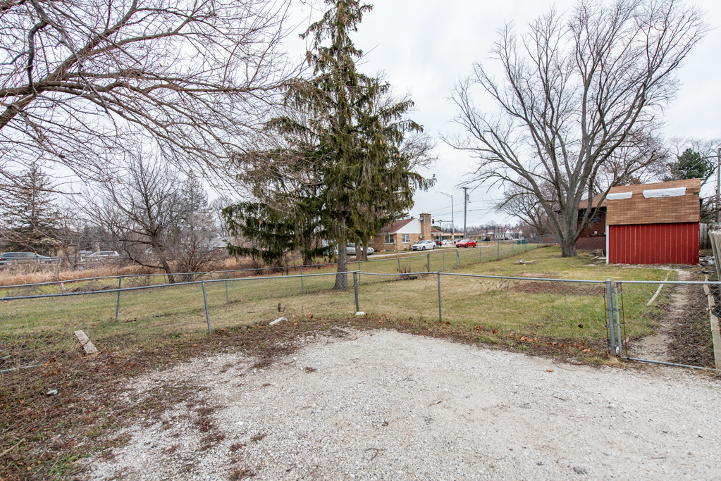 604 North Oplaine Road Waukegan, IL 60085 - Photo 31 of 31 a view of a yard with wooden fence
