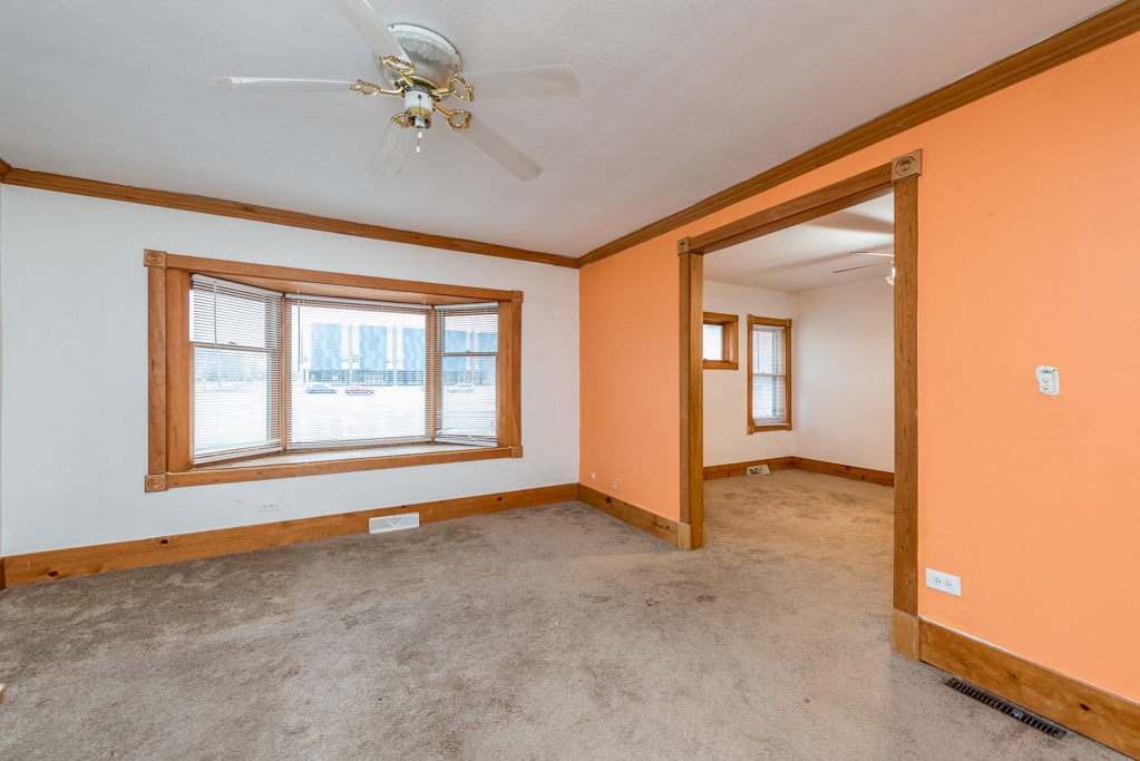 604 North Oplaine Road Waukegan, IL 60085 - Photo 4 of 31 a view of an empty room with a window