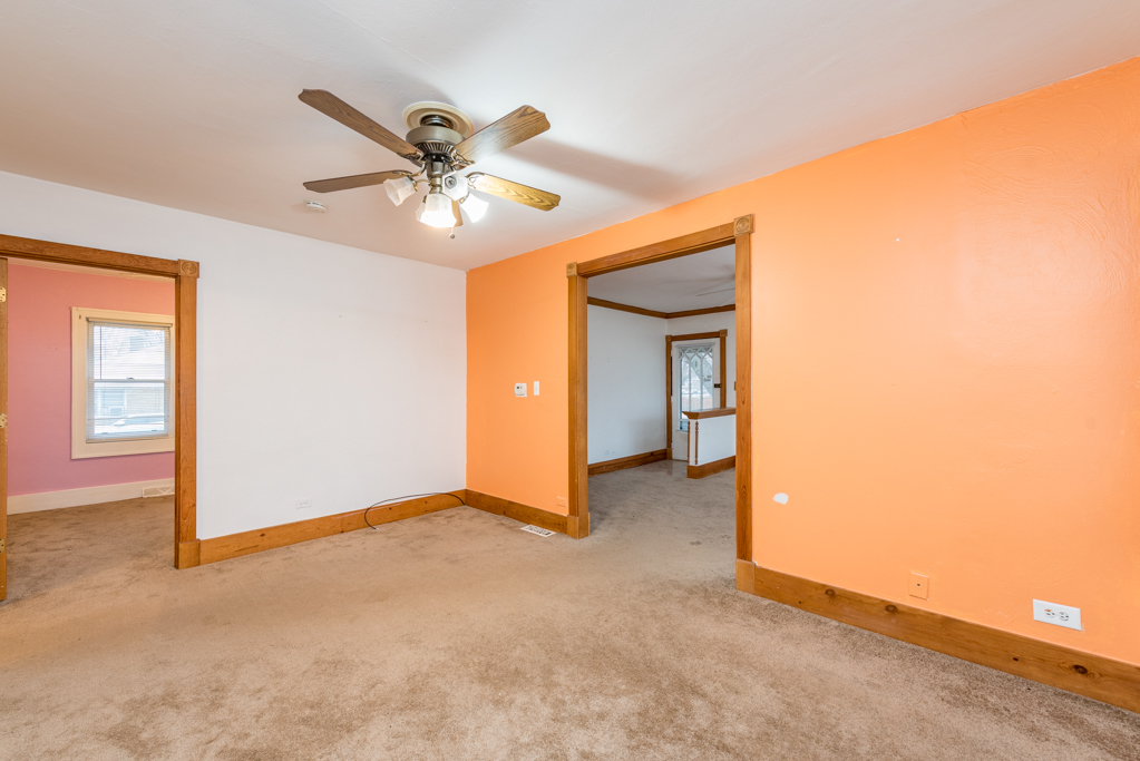 604 North Oplaine Road Waukegan, IL 60085 - Photo 8 of 31 a view of a livingroom with a ceiling fan and window