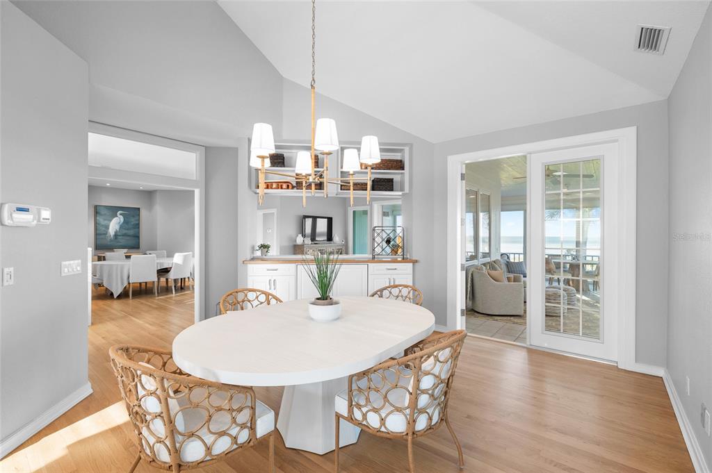 319 Pilot Point Lane Boca Grande, FL 33921 - Photo 11 of 62 a dining room with furniture and wooden floor