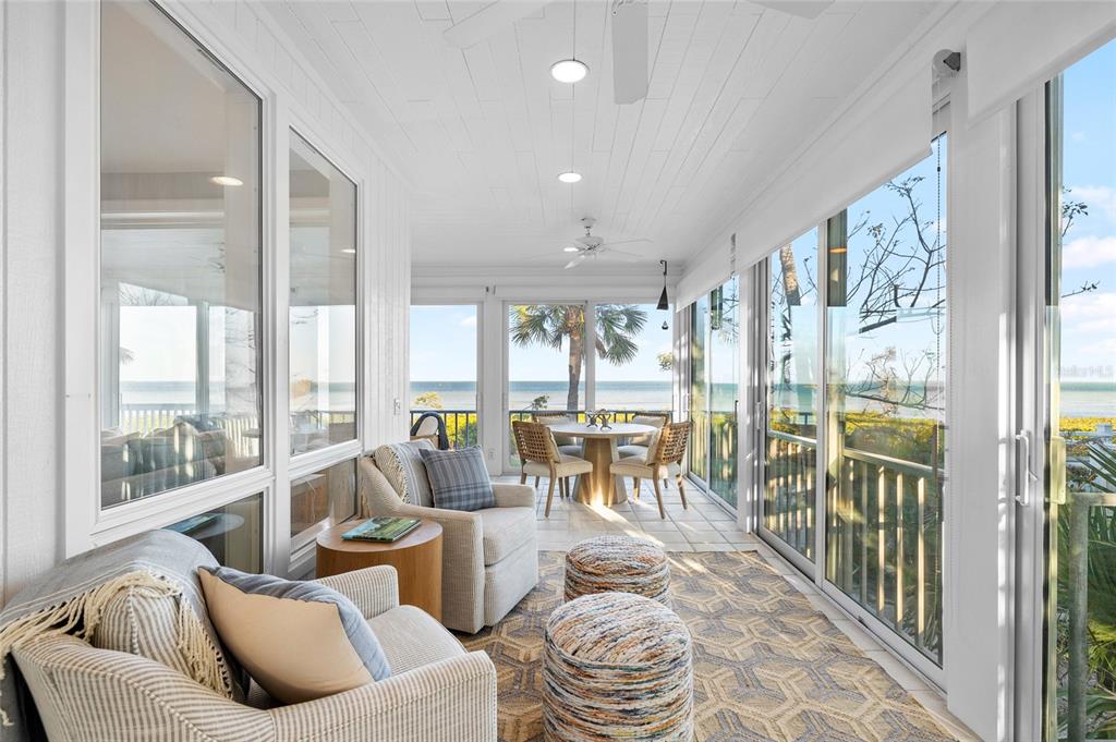 319 Pilot Point Lane Boca Grande, FL 33921 - Photo 17 of 62 a living room with furniture and floor to ceiling windows