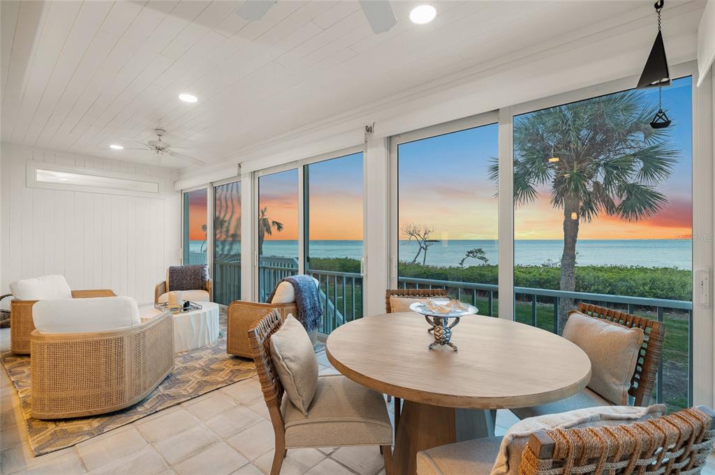 319 Pilot Point Lane Boca Grande, FL 33921 - Photo 18 of 62 a living room with patio furniture and a floor to ceiling window