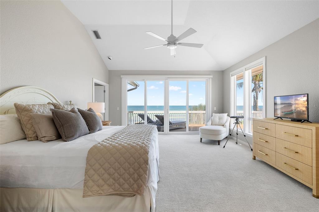 319 Pilot Point Lane Boca Grande, FL 33921 - Photo 19 of 62 a large bedroom with a bed and large windows