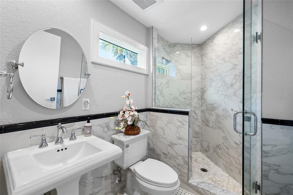 319 Pilot Point Lane Boca Grande, FL 33921 - Photo 33 of 62 a bathroom with a sink a toilet and shower