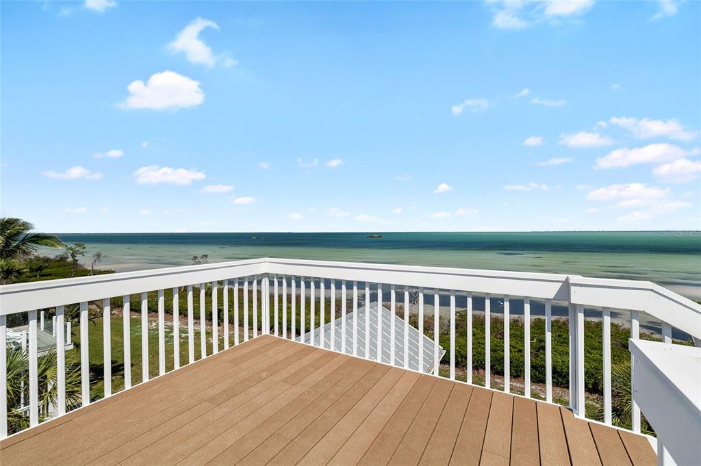 319 Pilot Point Lane Boca Grande, FL 33921 - Photo 43 of 62 a view of balcony with wooden floor