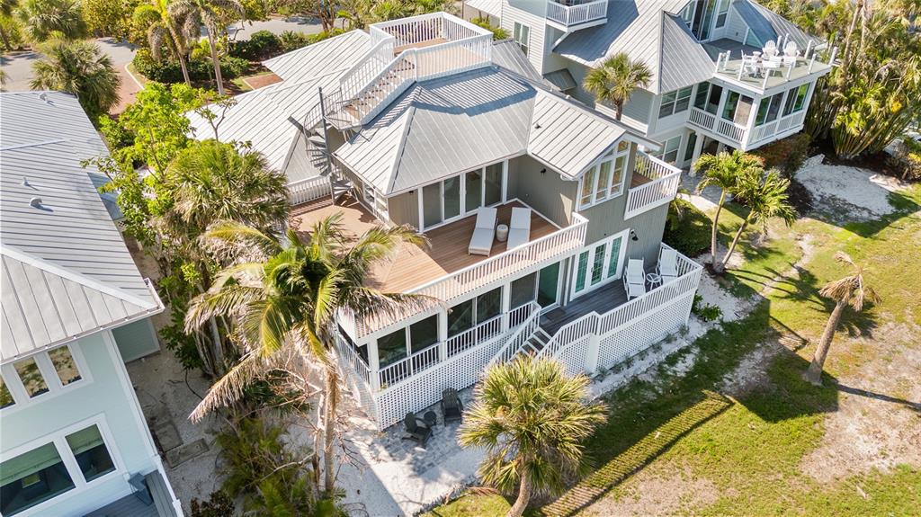 319 Pilot Point Lane Boca Grande, FL 33921 - Photo 47 of 62 an aerial view of a house with a yard and balcony