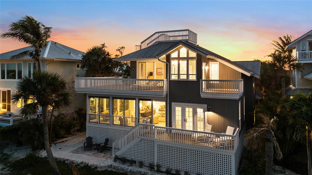 319 Pilot Point Lane Boca Grande, FL 33921 - Photo 54 of 62 a front view of a house with a yard