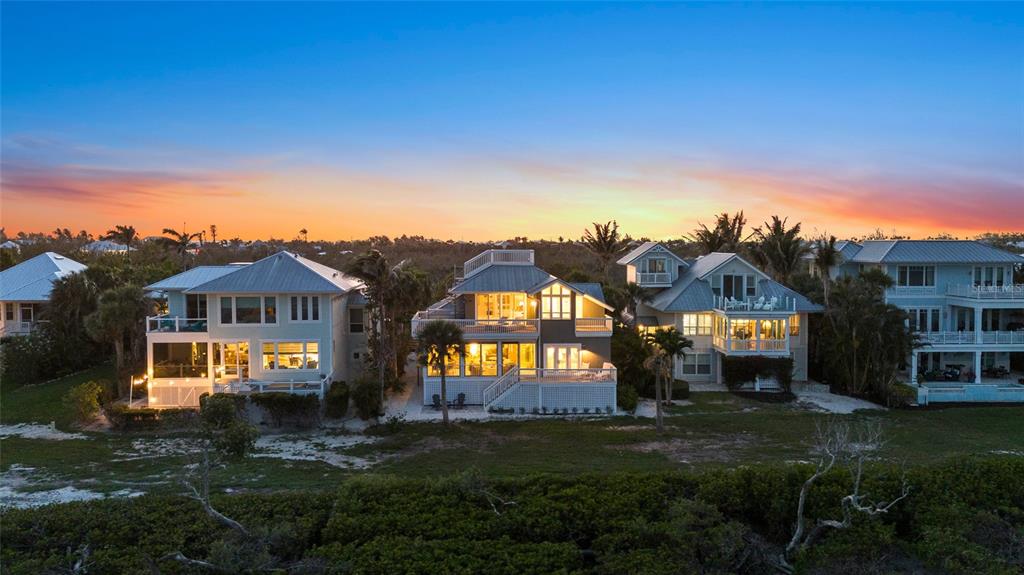 319 Pilot Point Lane Boca Grande, FL 33921 - Photo 56 of 62 a front view of a house with a garden