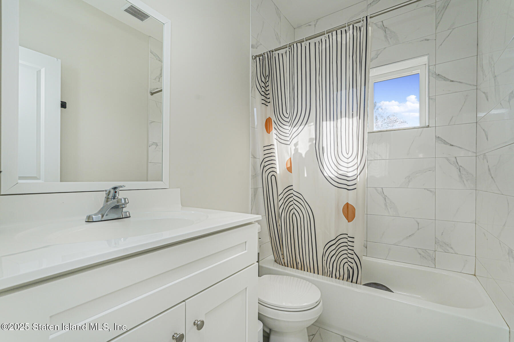 25 Ardmore Avenue Staten Island, NY 10314 - Photo 16 of 27 a bathroom with a sink a toilet and shower