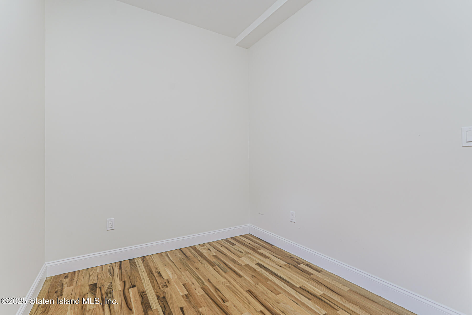 25 Ardmore Avenue Staten Island, NY 10314 - Photo 19 of 27 a view of wooden floor in a room