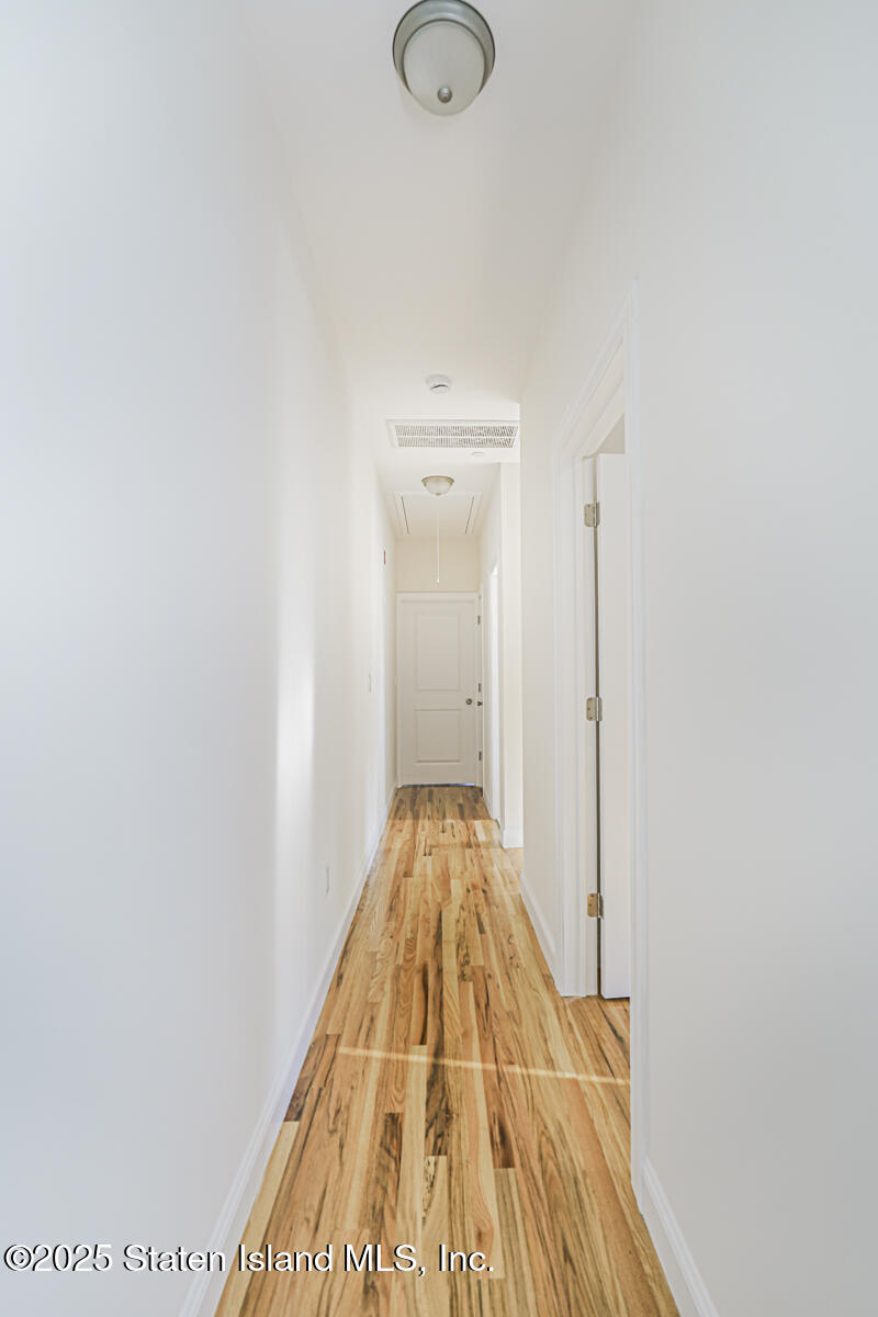 25 Ardmore Avenue Staten Island, NY 10314 - Photo 20 of 27 a view of a hallway with wooden floor