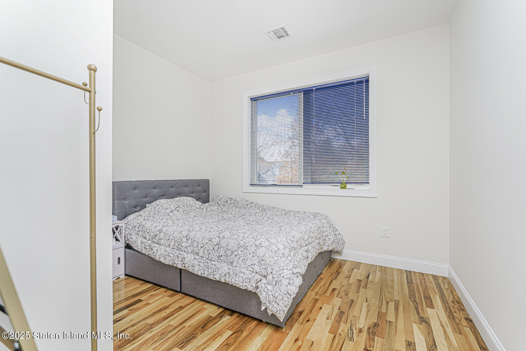 25 Ardmore Avenue Staten Island, NY 10314 - Photo 21 of 27 a bedroom with a bed and a window