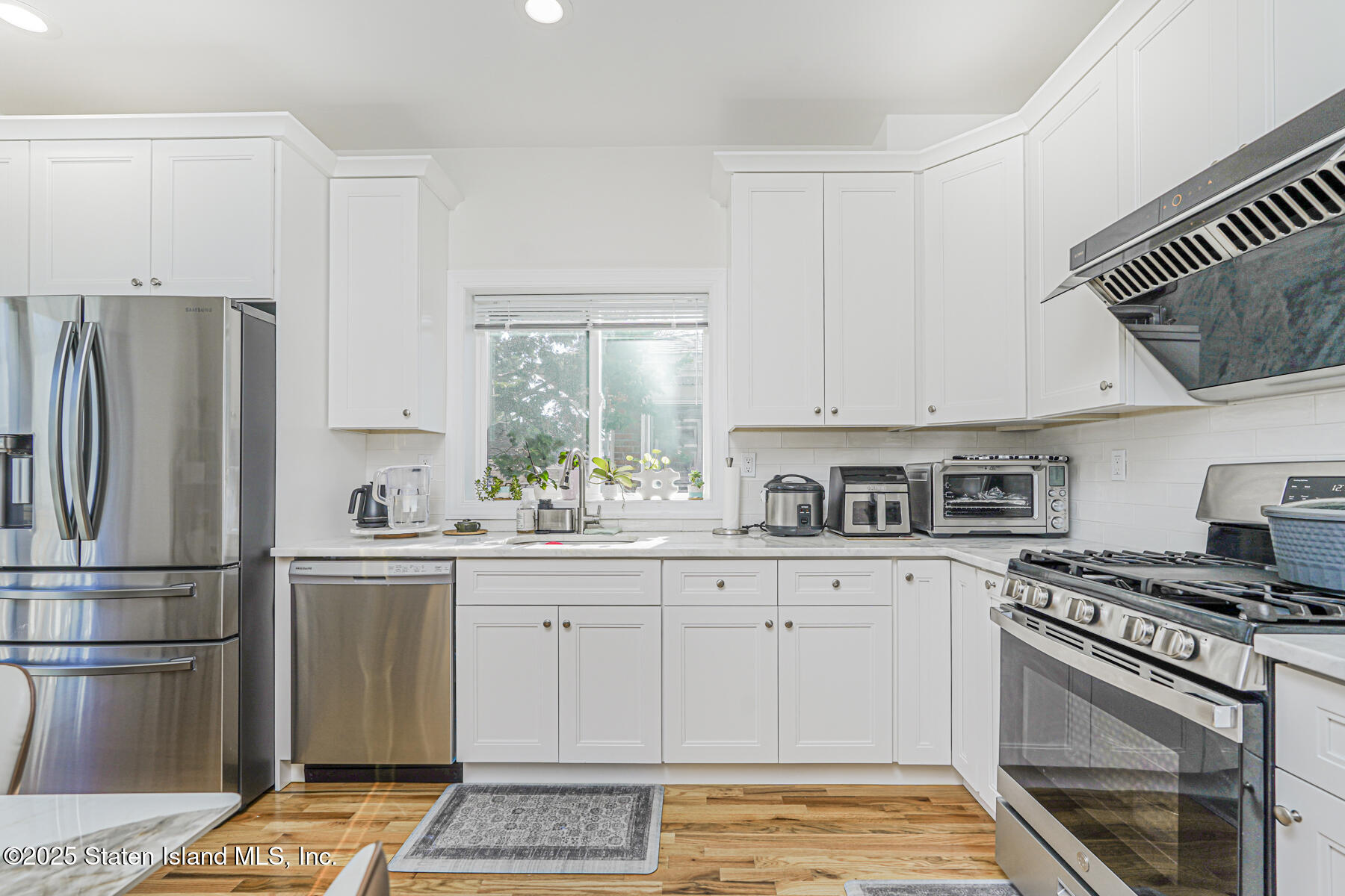 25 Ardmore Avenue Staten Island, NY 10314 - Photo 24 of 27 a kitchen with stainless steel appliances a stove a sink and a refrigerator