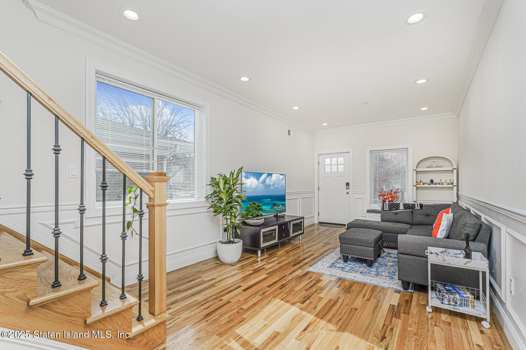 25 Ardmore Avenue Staten Island, NY 10314 - Photo 6 of 27 a living room with furniture and a wooden floor