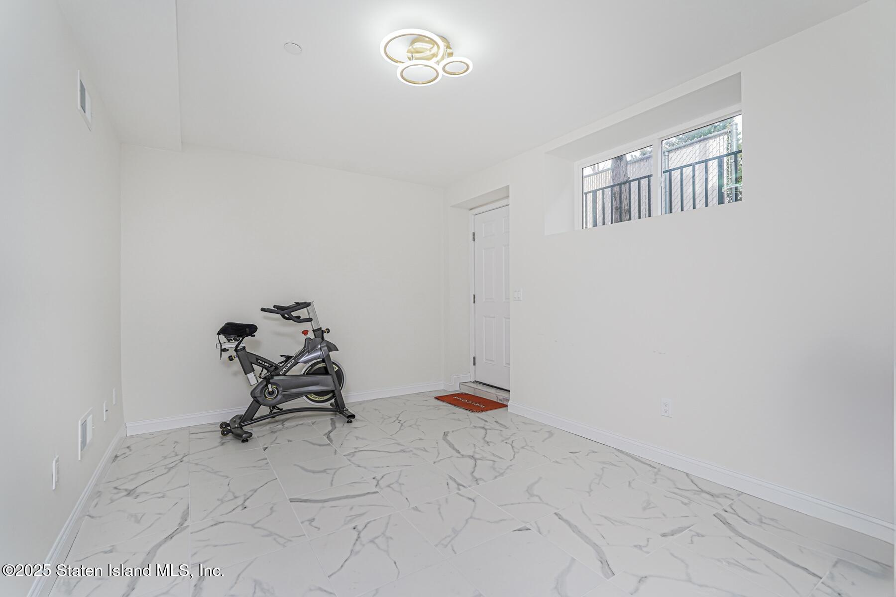 25 Ardmore Avenue Staten Island, NY 10314 - Photo 8 of 27 a view of a room with gym equipment