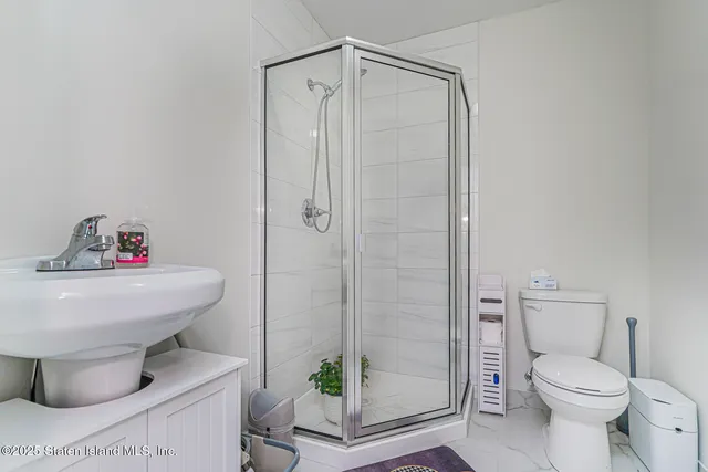 a view of living room with furniture and white walls