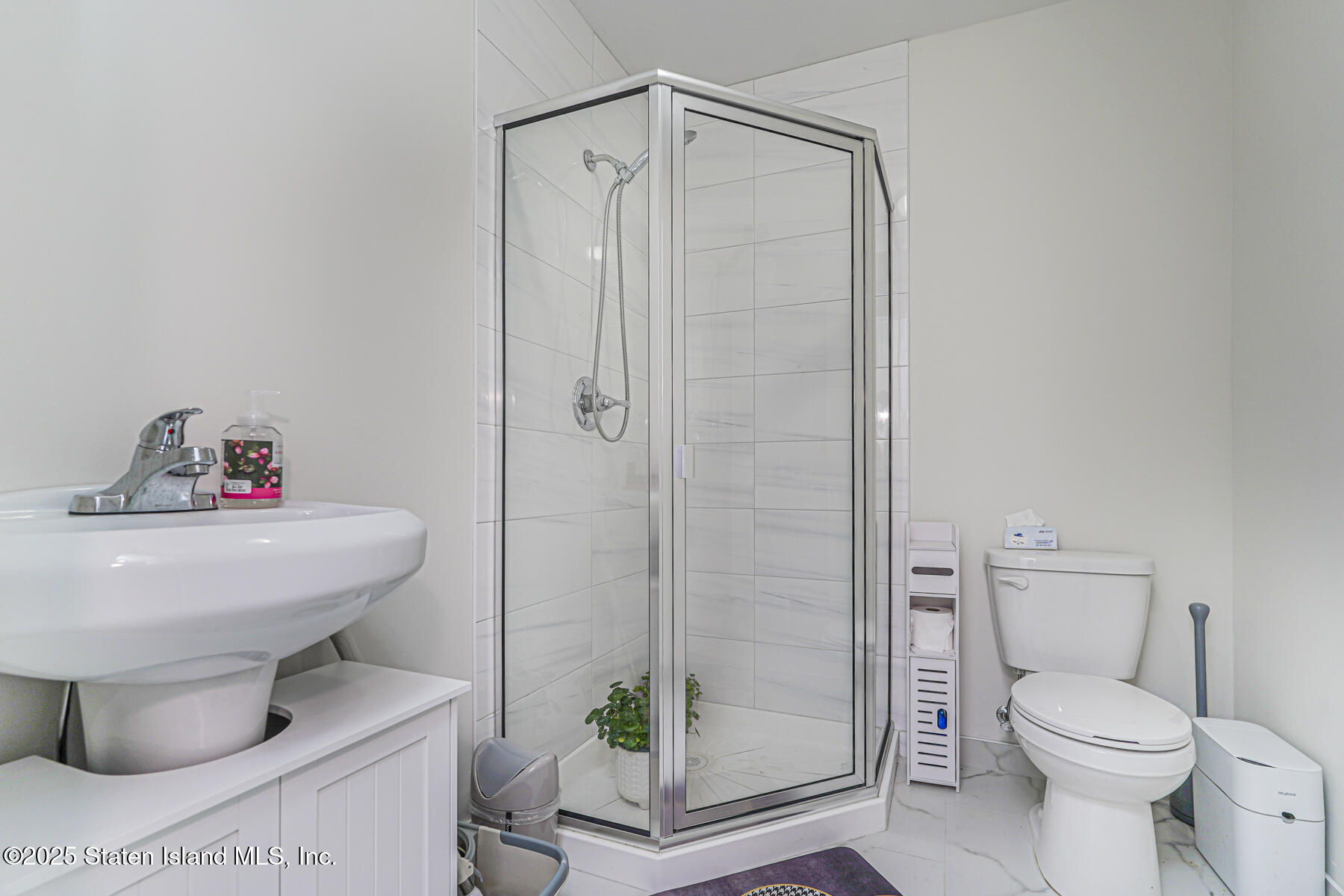 25 Ardmore Avenue Staten Island, NY 10314 - Photo 10 of 27 a bathroom with a toilet and a shower