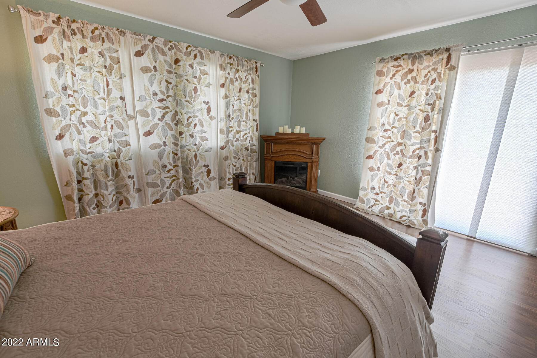 6175 Sutter Drive Lakeside, AZ 85929 - Photo 20 of 38 a bedroom with a large bed and a fireplace