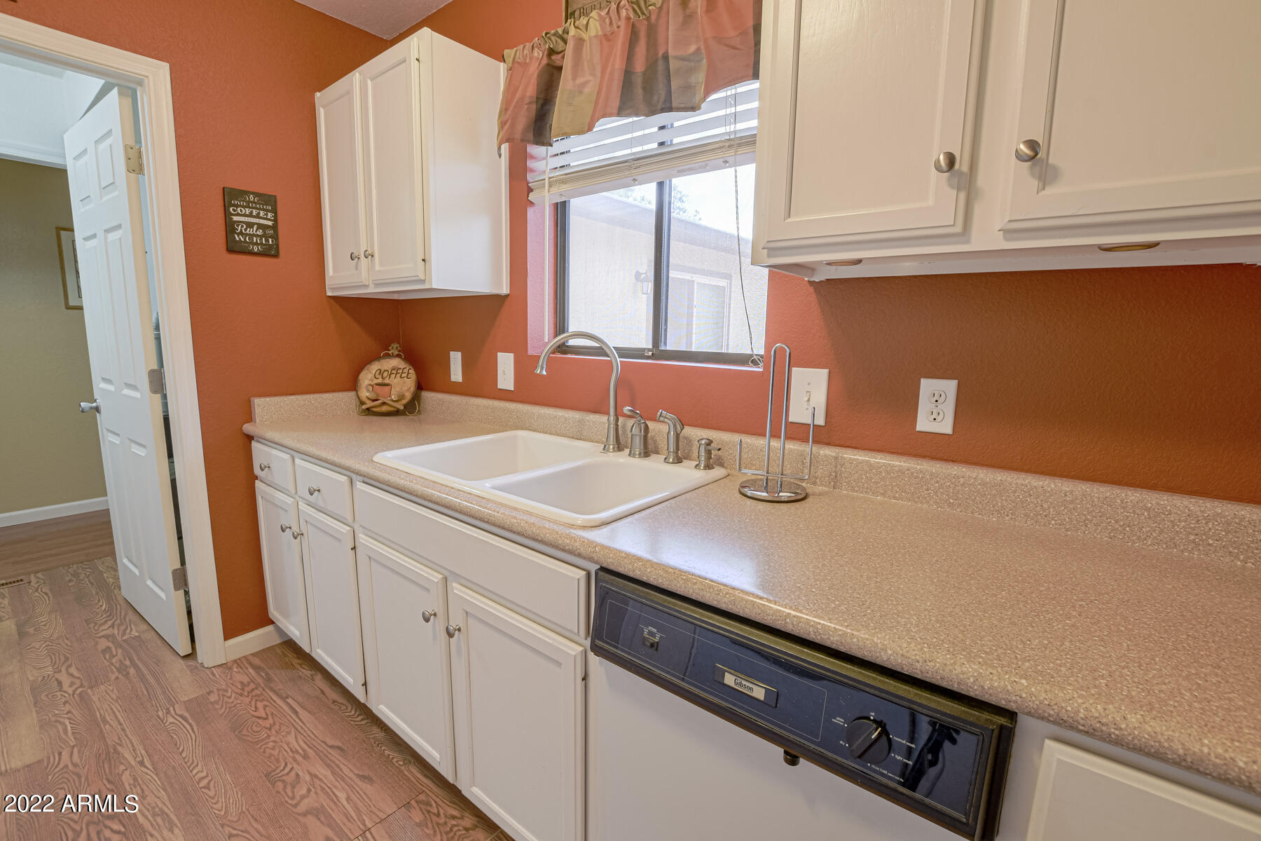 6175 Sutter Drive Lakeside, AZ 85929 - Photo 9 of 38 a kitchen with a sink cabinets and a window