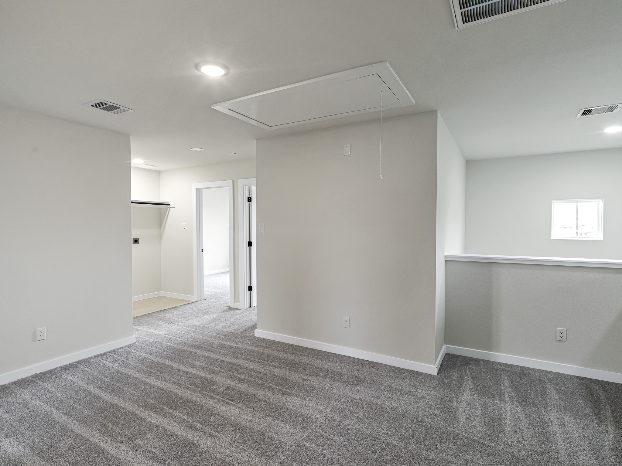1006 4th Street Hempstead, TX 77445 - Photo 14 of 29 an empty room with wooden floor and windows